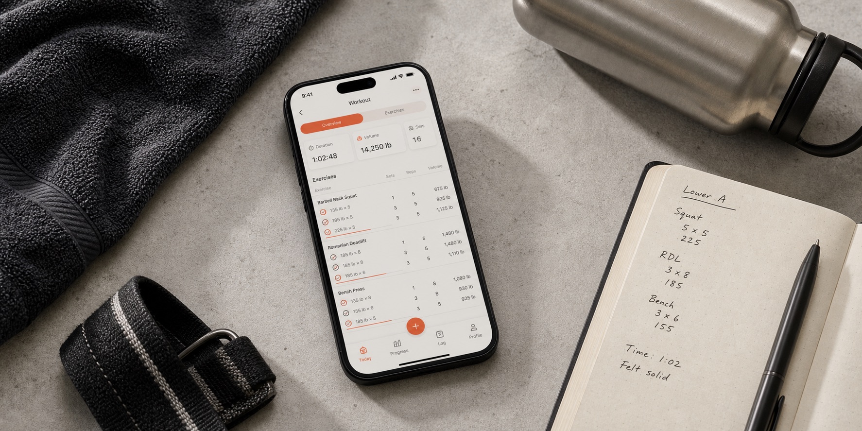 Workout tracker app comparison testing setup on a gym table